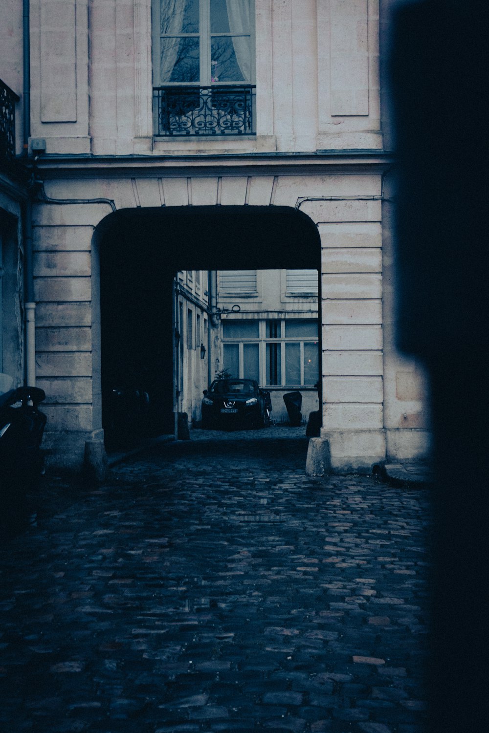 a black and white photo of an entrance to a building