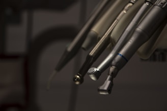 a close up of a pair of scissors hanging from a hook