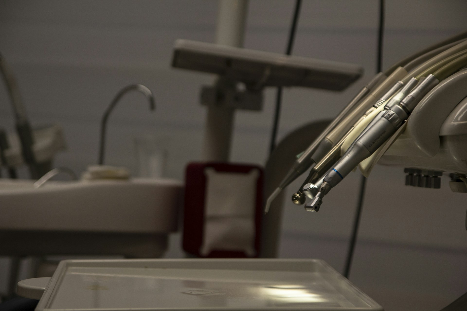 a dental room with a sink and dental equipment
