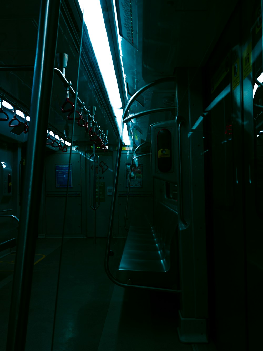 a subway car with its lights on at night