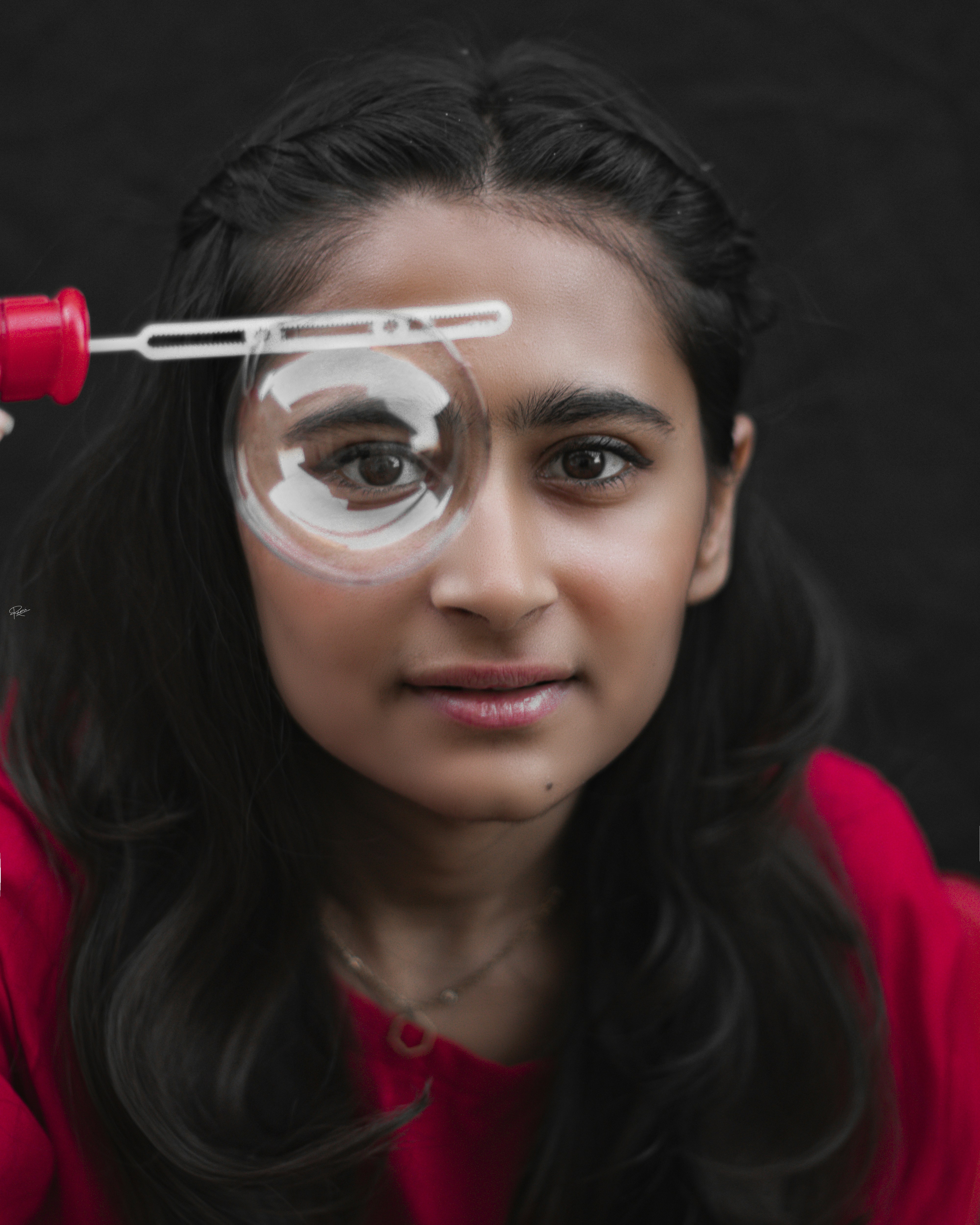 a woman with a magnifying glass on her face