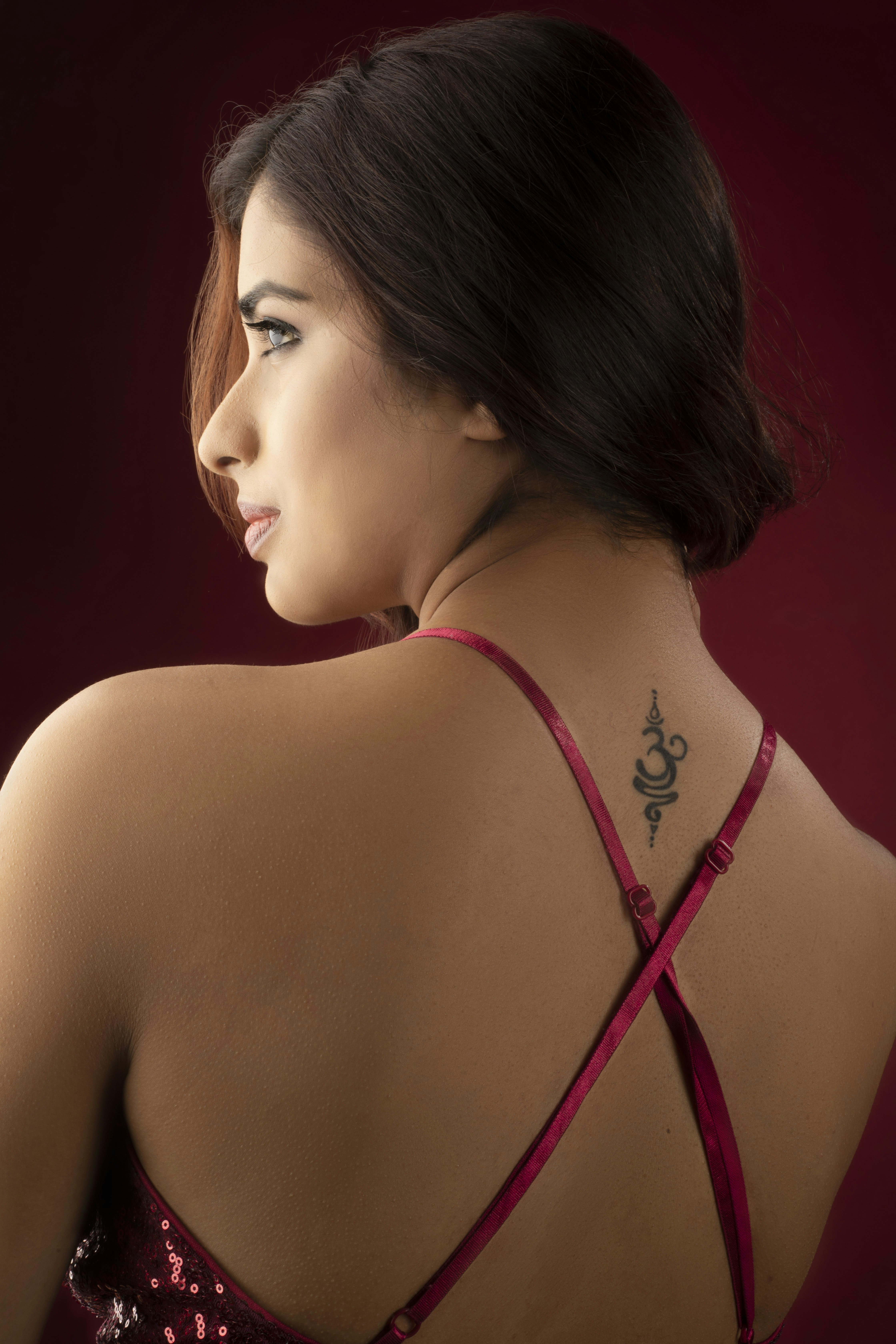 a woman with a tattoo on her back