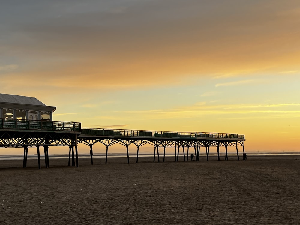 a long pier with a building on top of it