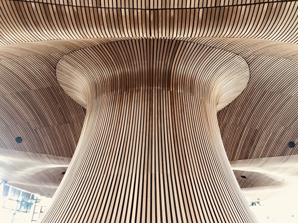 a large wooden structure with a clock at the top of it