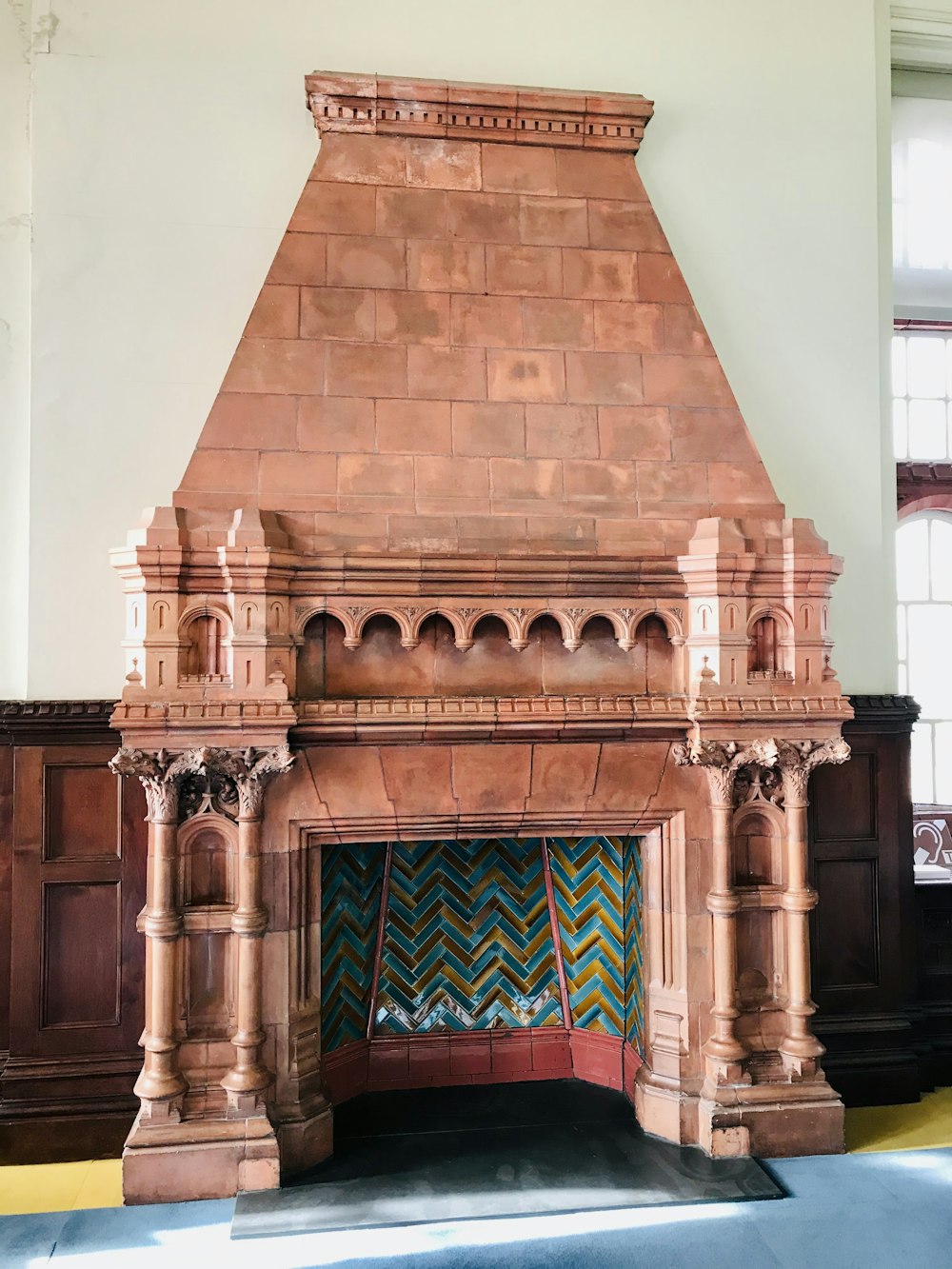 a fireplace in a room with a large brick fireplace