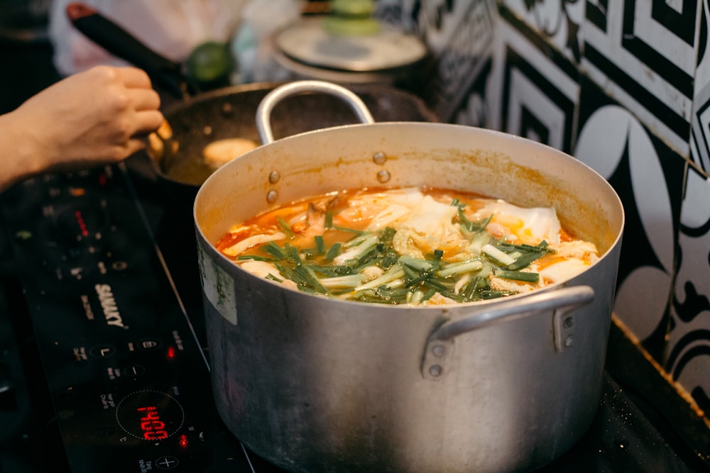 a pot of food sitting on top of a stove