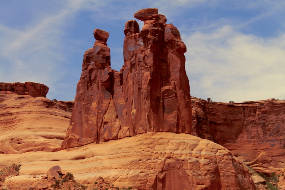 a large rock formation in the middle of a desert