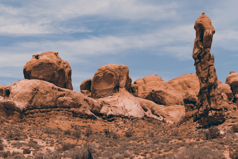 a large rock formation in the middle of a desert