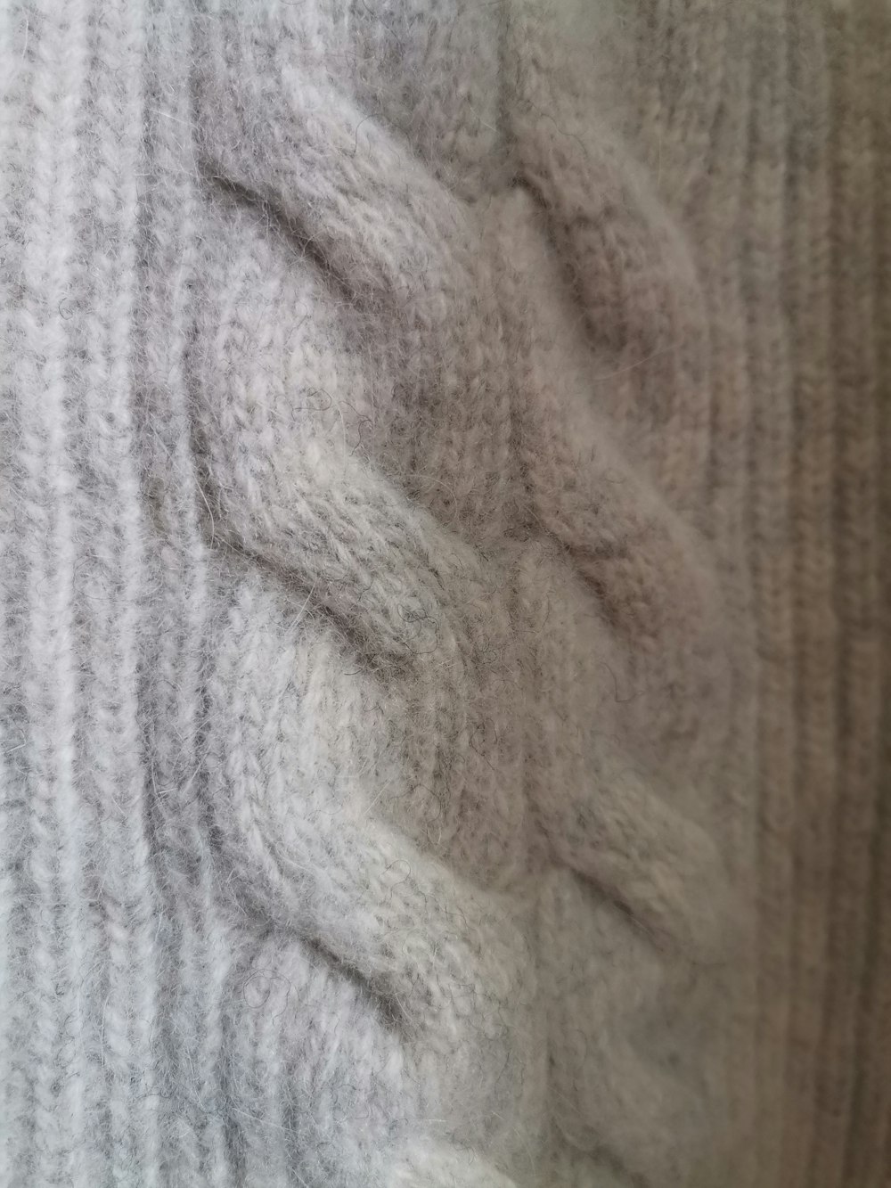 a close up of a sweater with a pattern on it