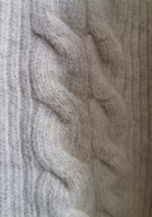 a close up of a sweater with a pattern on it