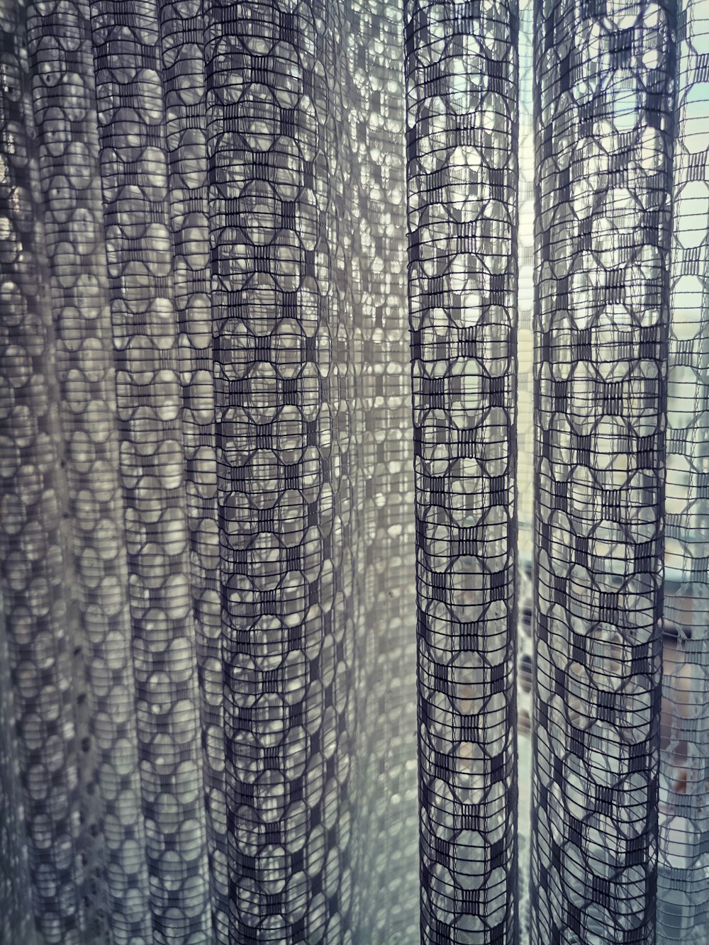 a close up of a curtain with circles on it