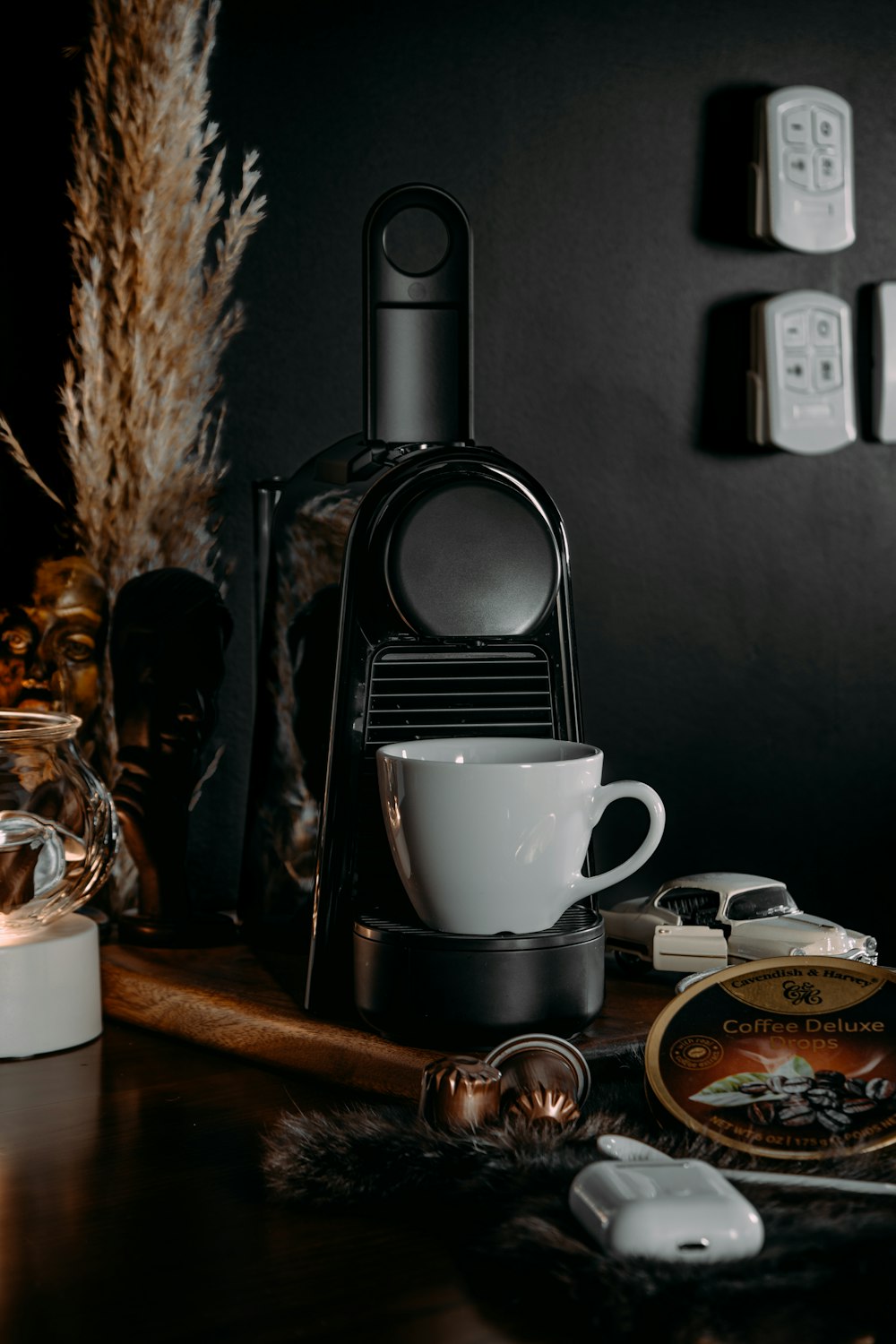 a coffee maker sitting on top of a wooden table