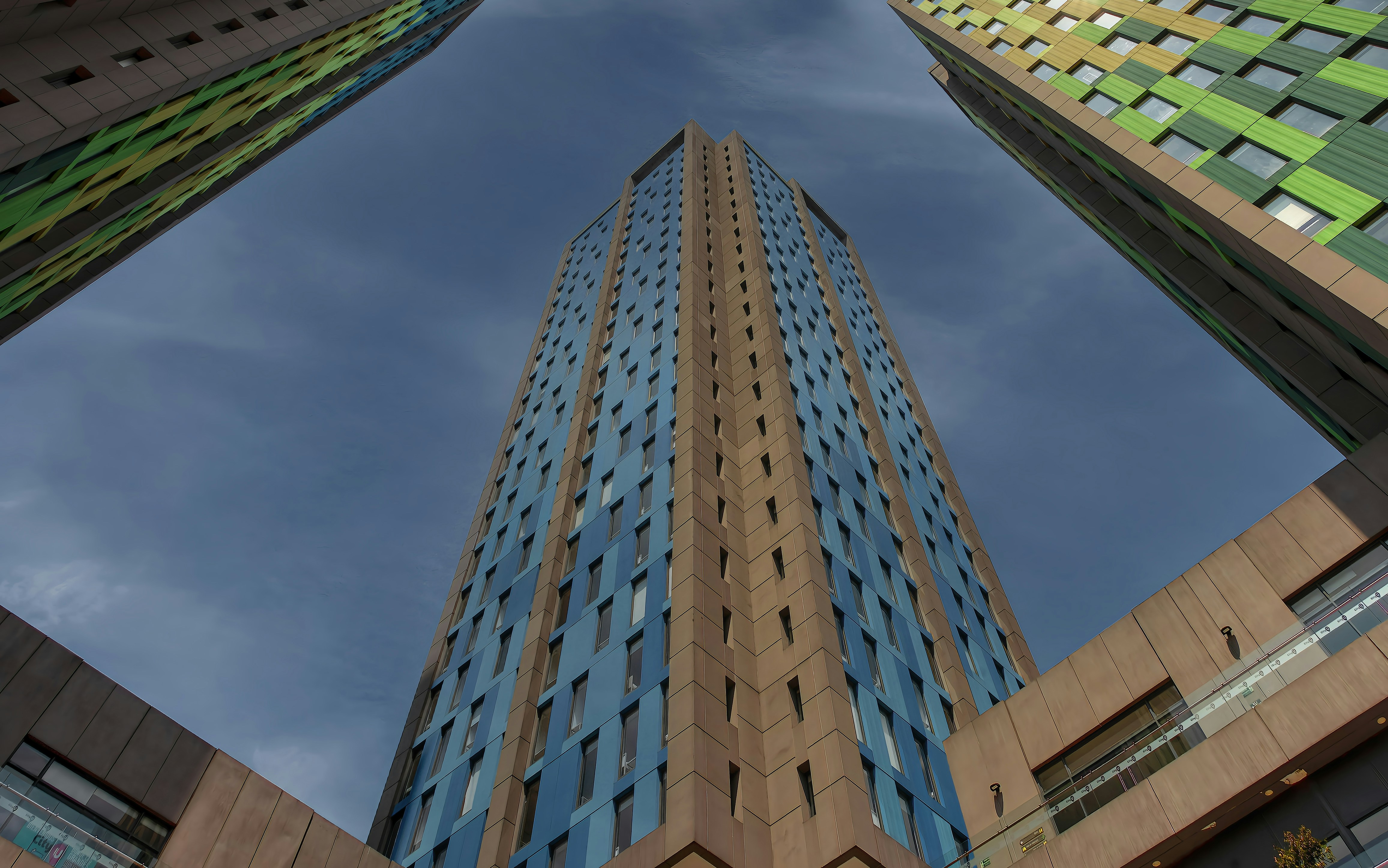 looking up at a tall building from the ground, Colour framed
