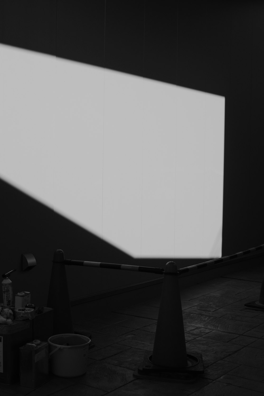 a room with a large white screen on the wall