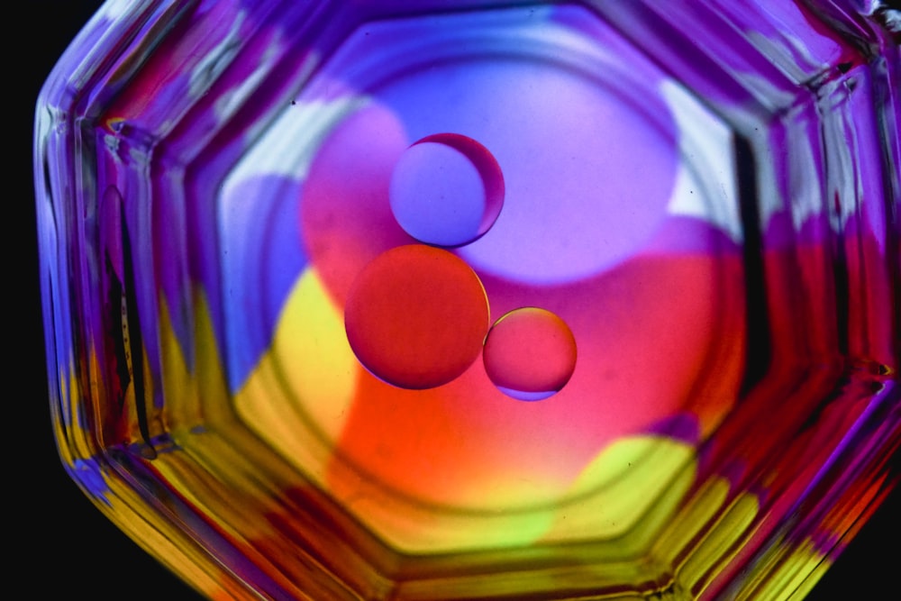 a close up of a colorful glass object