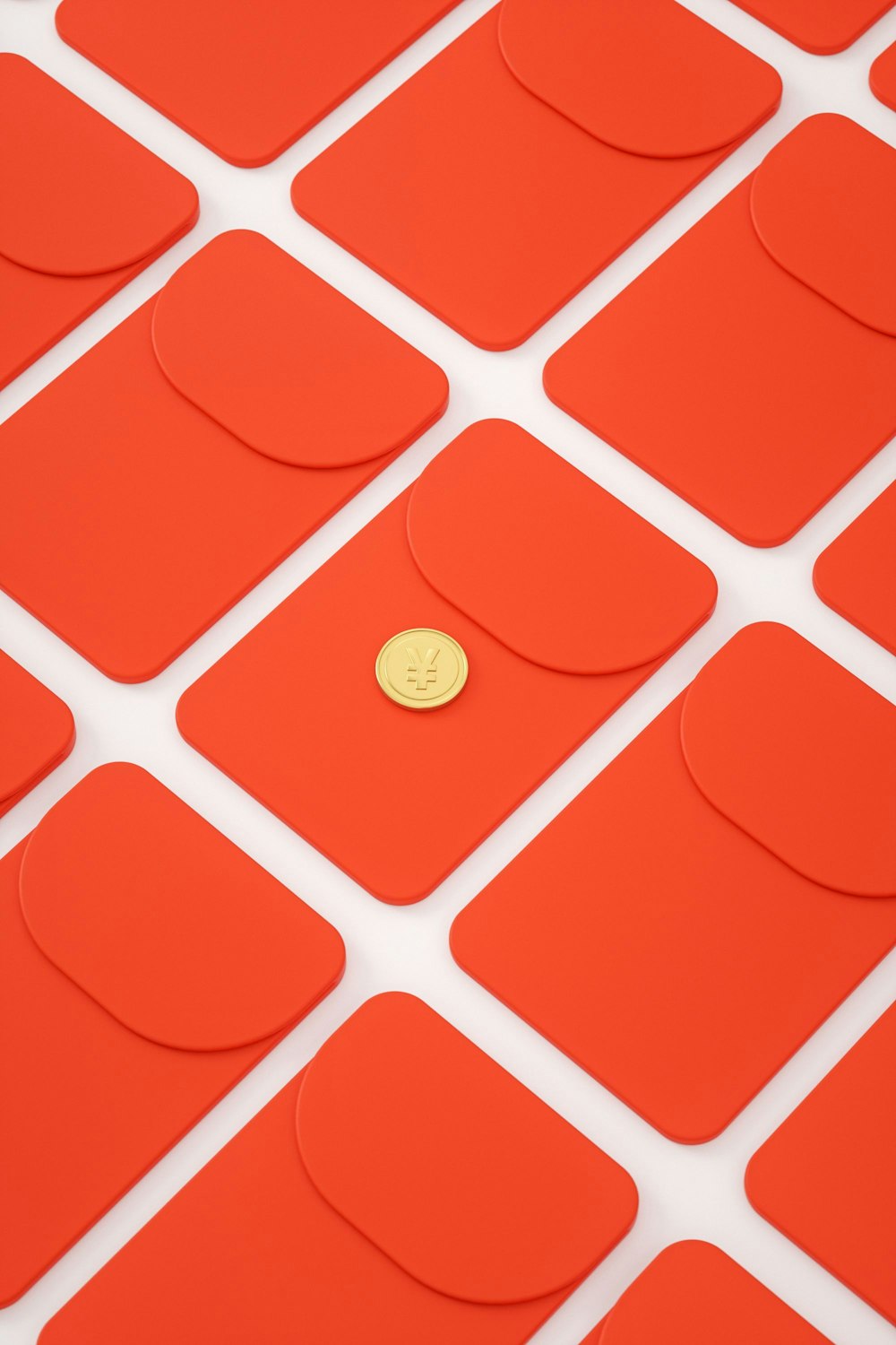 a gold button sitting on top of a red surface