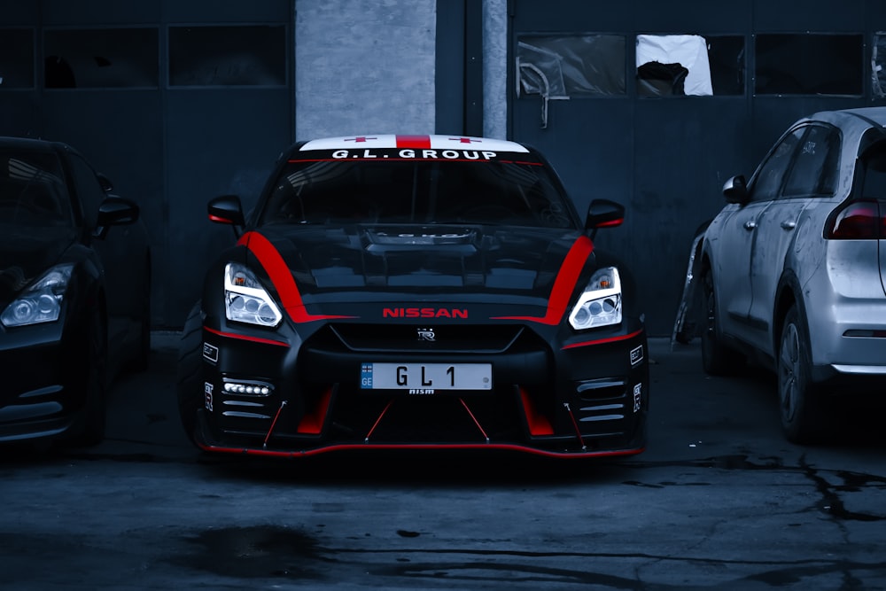 a car parked in a garage next to other cars