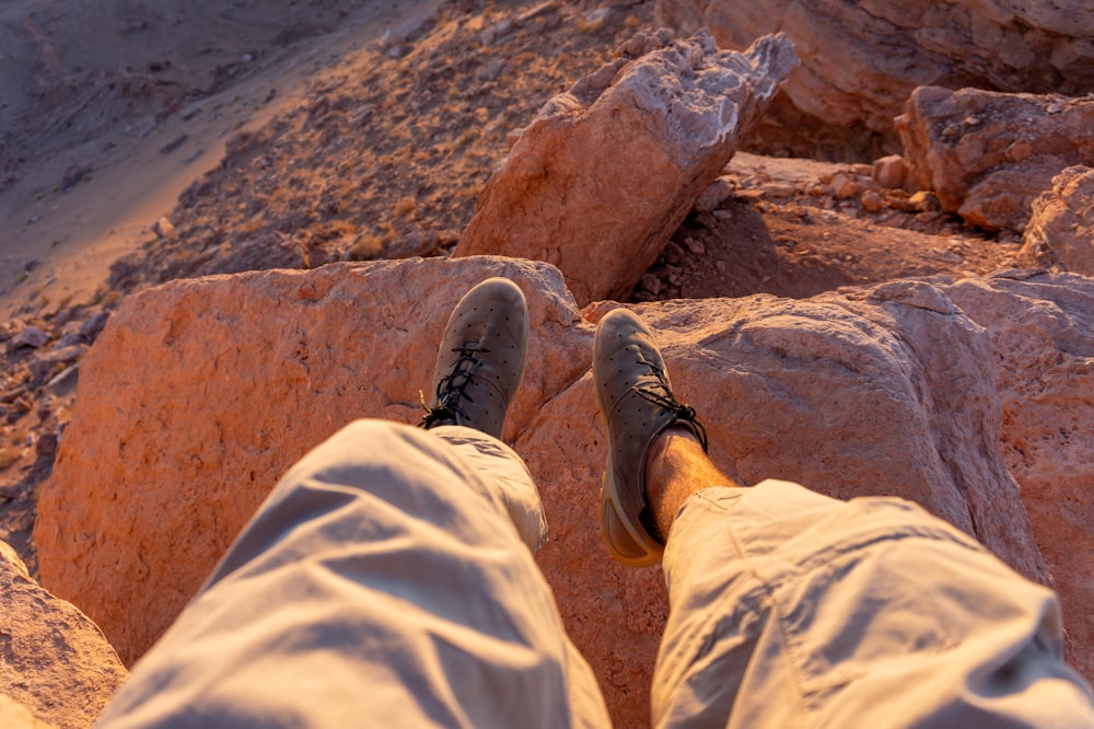 a person standing on top of a rocky cliff