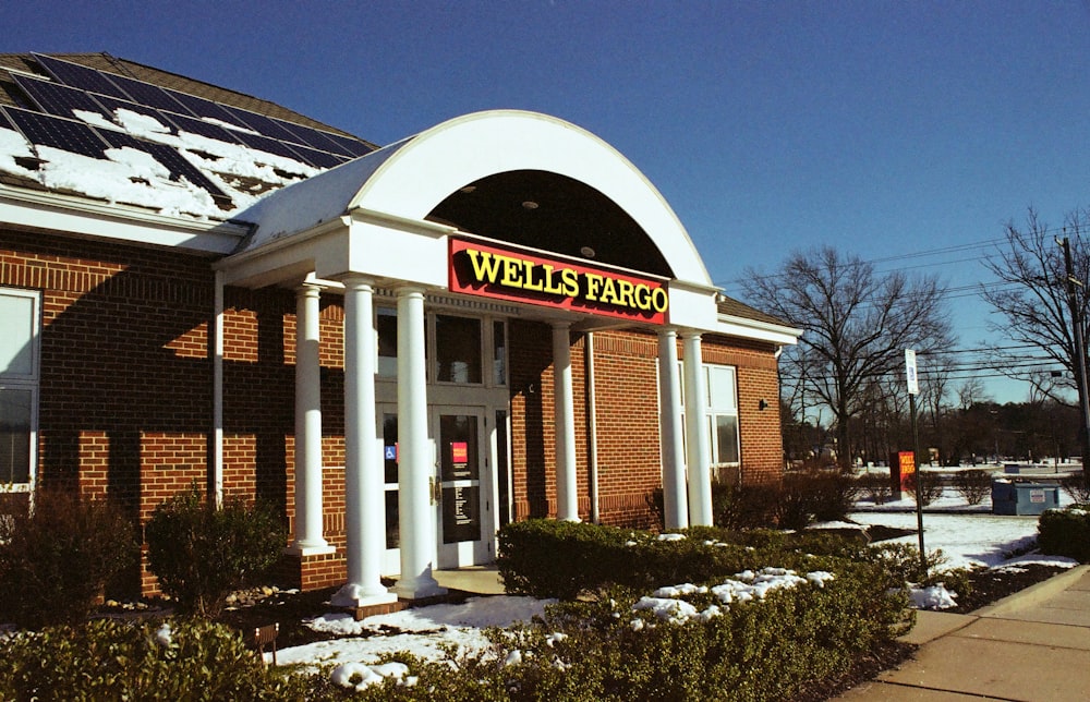 a store front with snow on the ground