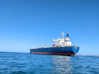 a large boat floating on top of a body of water