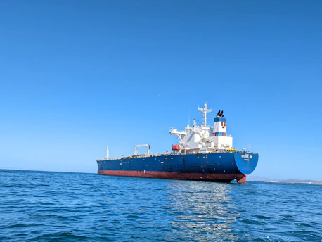 a large boat floating on top of a body of water
