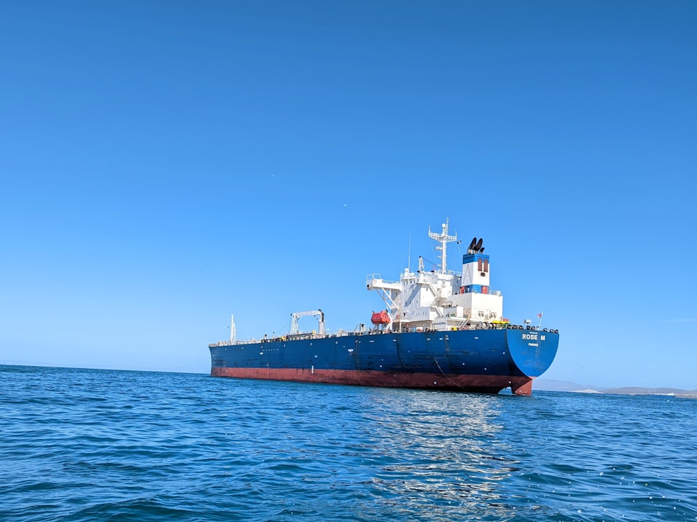 a large boat floating on top of a body of water