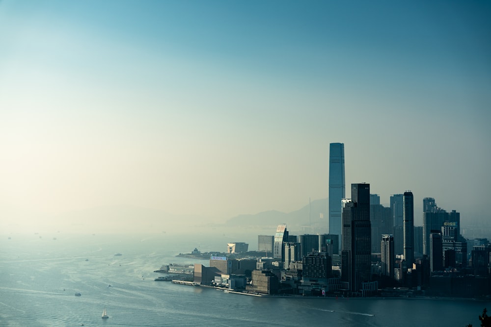 a large body of water with a city in the background