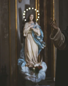 Gentle illustration of a child praying next to a softly glowing Jesus figure.