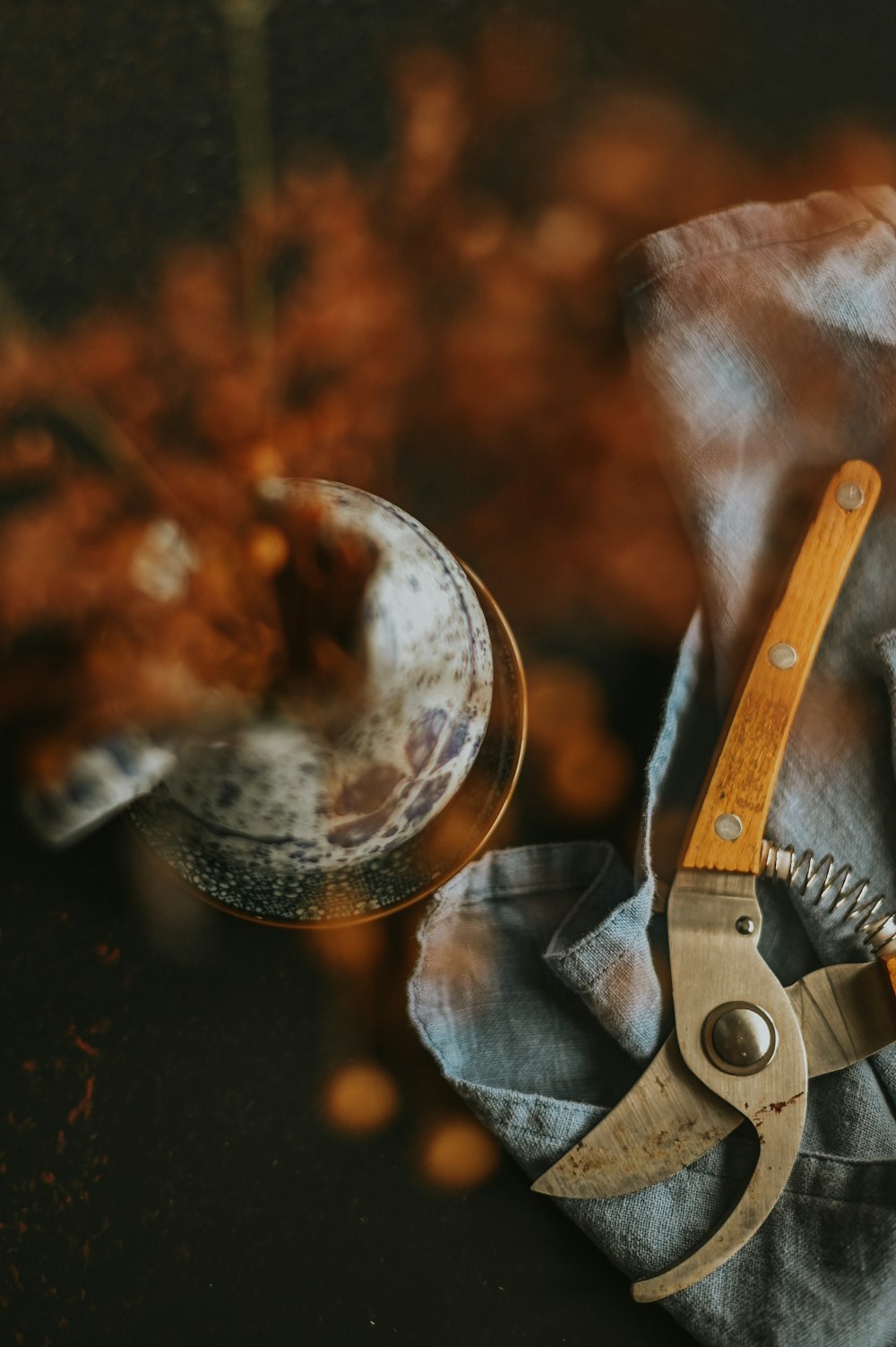 a pair of scissors sitting on top of a cloth