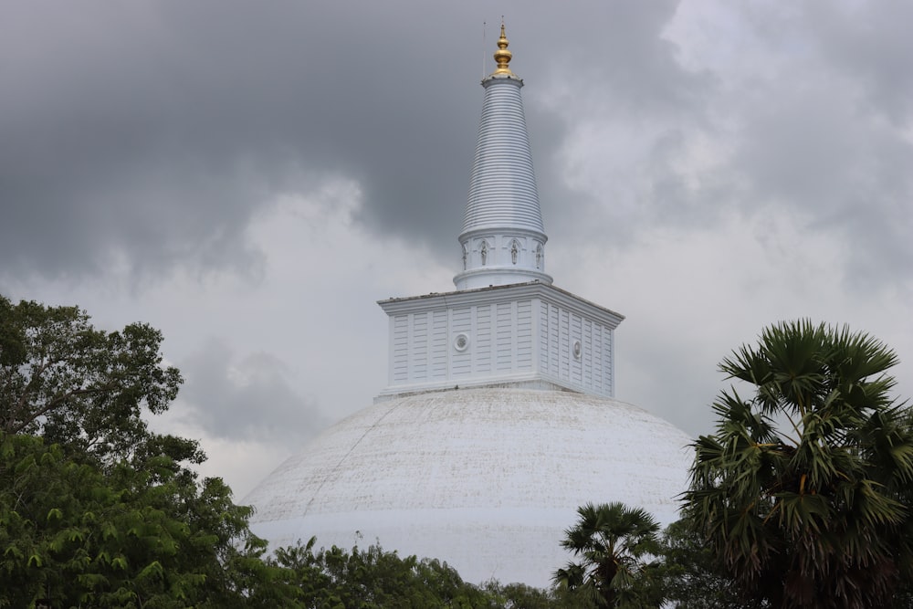 a large white building with a golden top