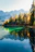A serene mountain lake reflecting vivid autumn foliage under a soft morning sky.