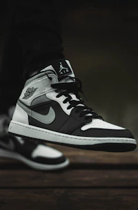 Close-up of a breathable, stylish sneaker resting on urban pavement, emphasizing comfort and design.