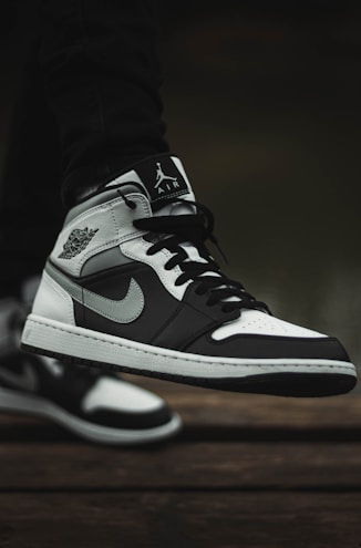 Close-up of a papilora sneaker with clean lines and modern design on a concrete sidewalk.