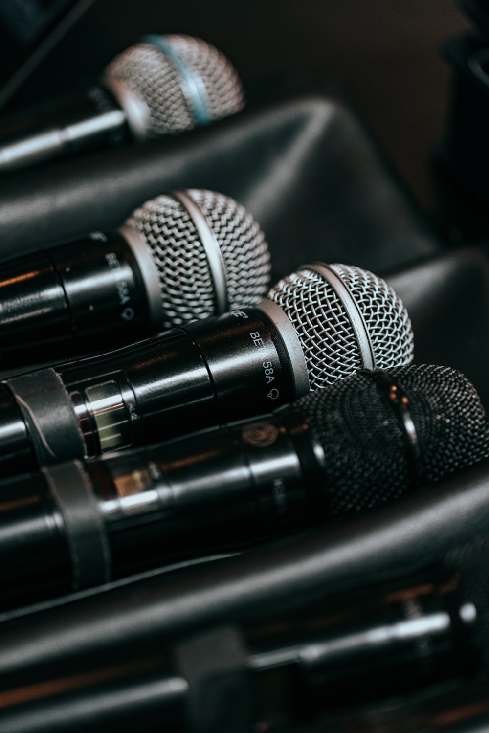 a group of microphones sitting on top of a black case