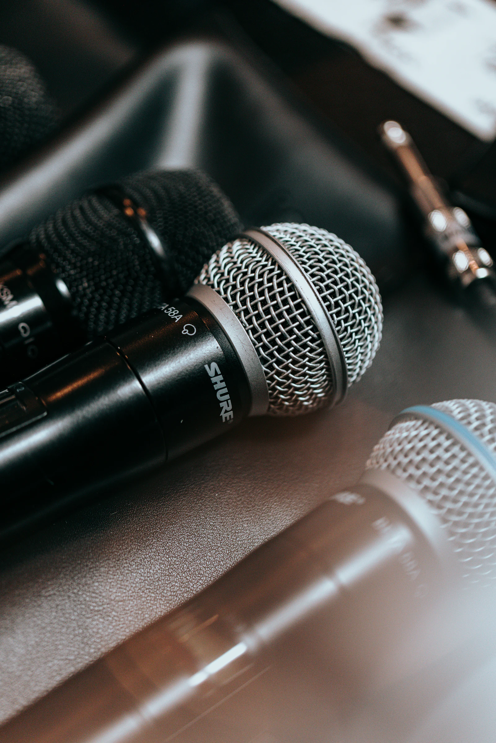 Two microphones set up close together at a briefing