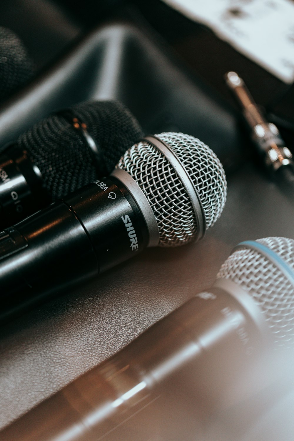 a close up of two microphones on a table