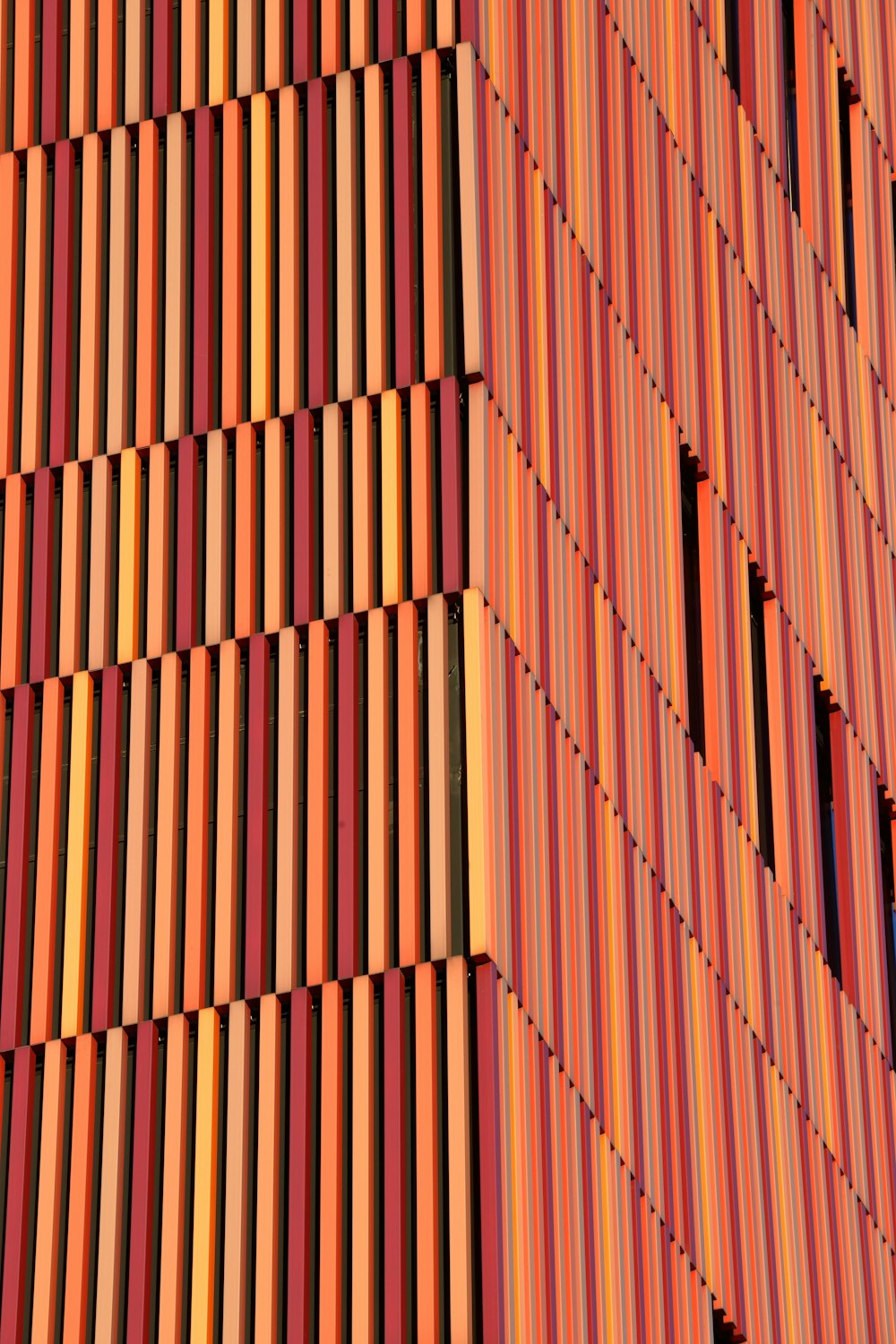a close up of a building made of wood planks