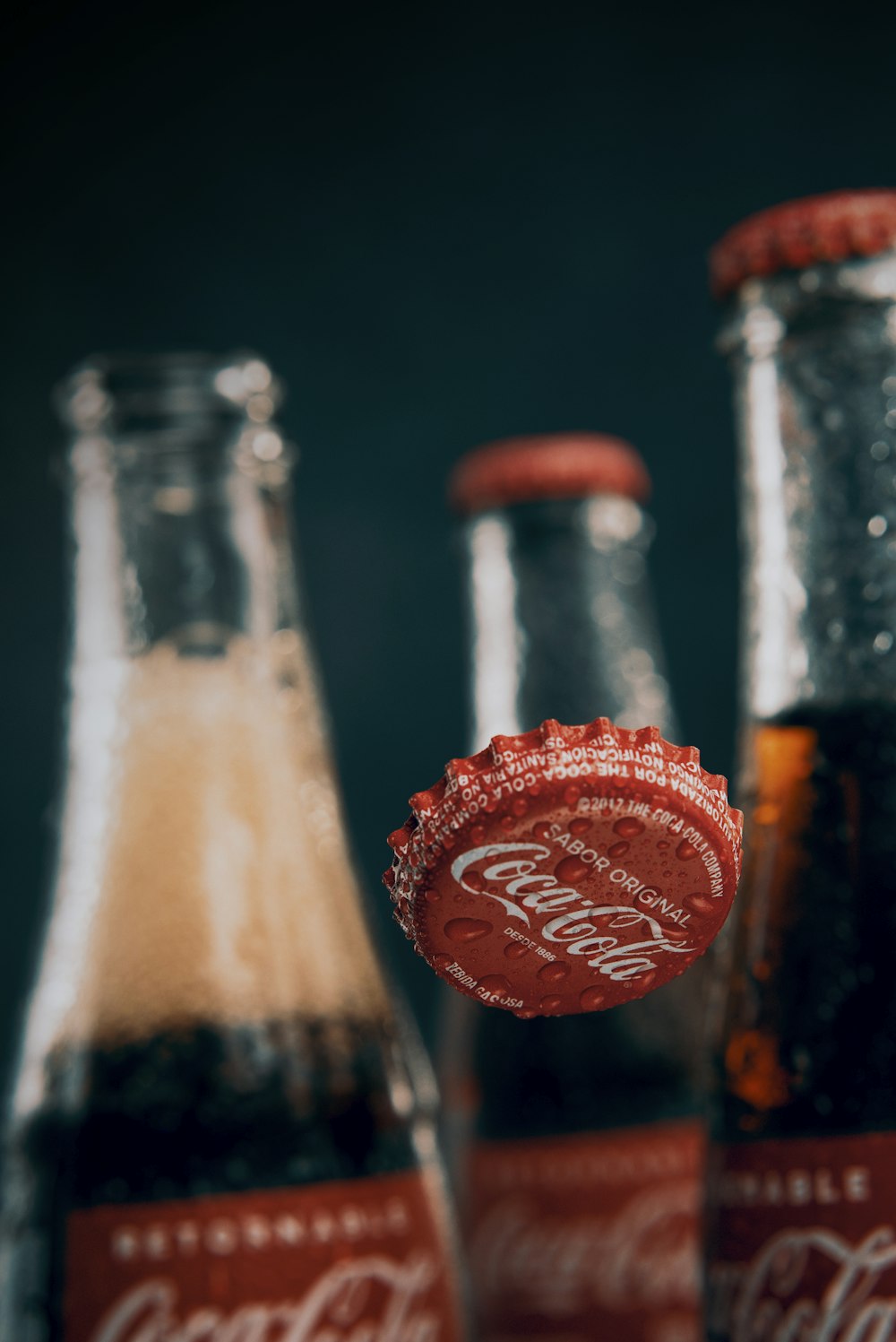 a close up of a coca - cola bottle opener
