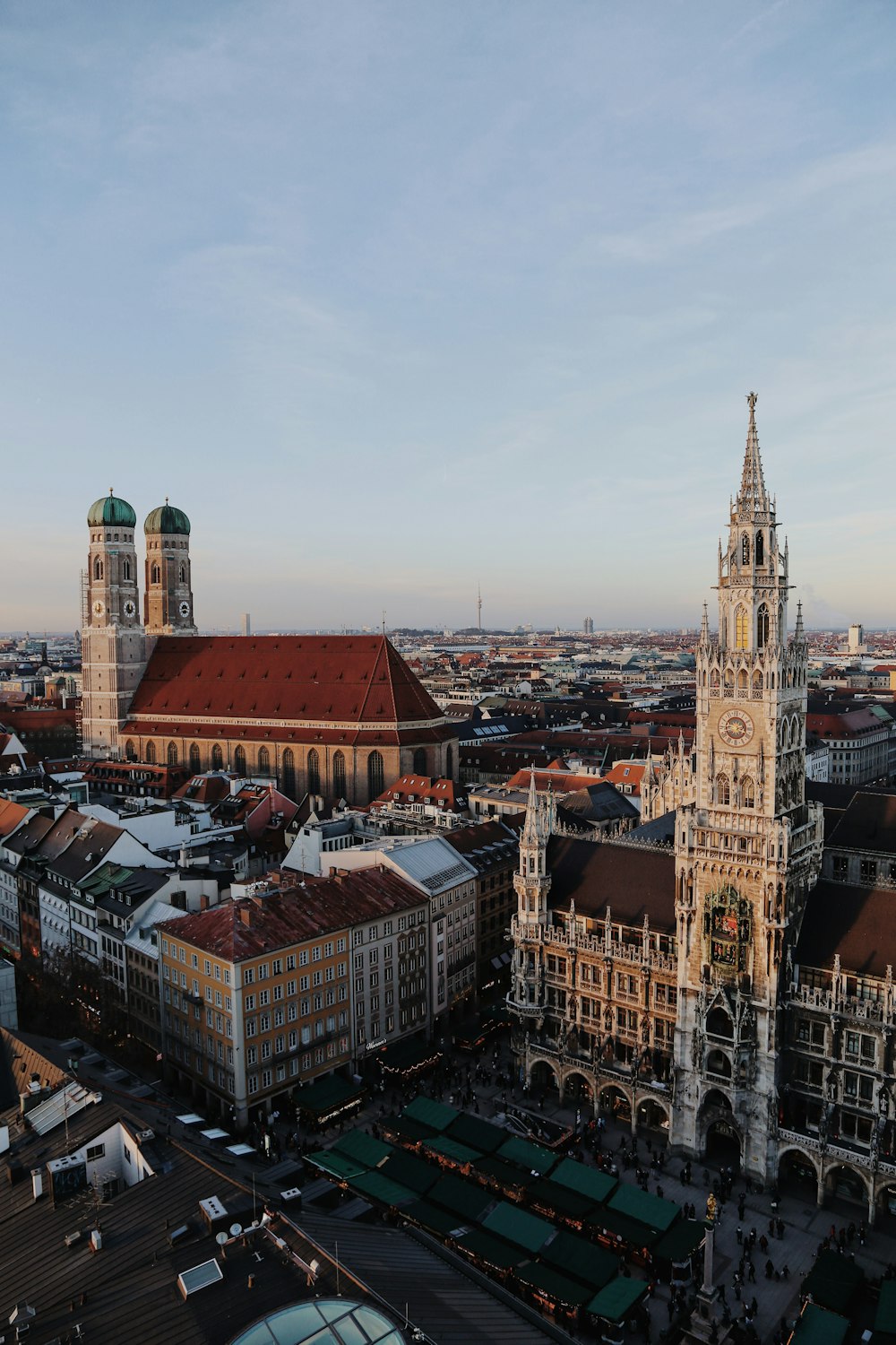 an aerial view of a city with a clock tower