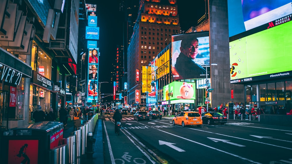 a city street filled with lots of tall buildings