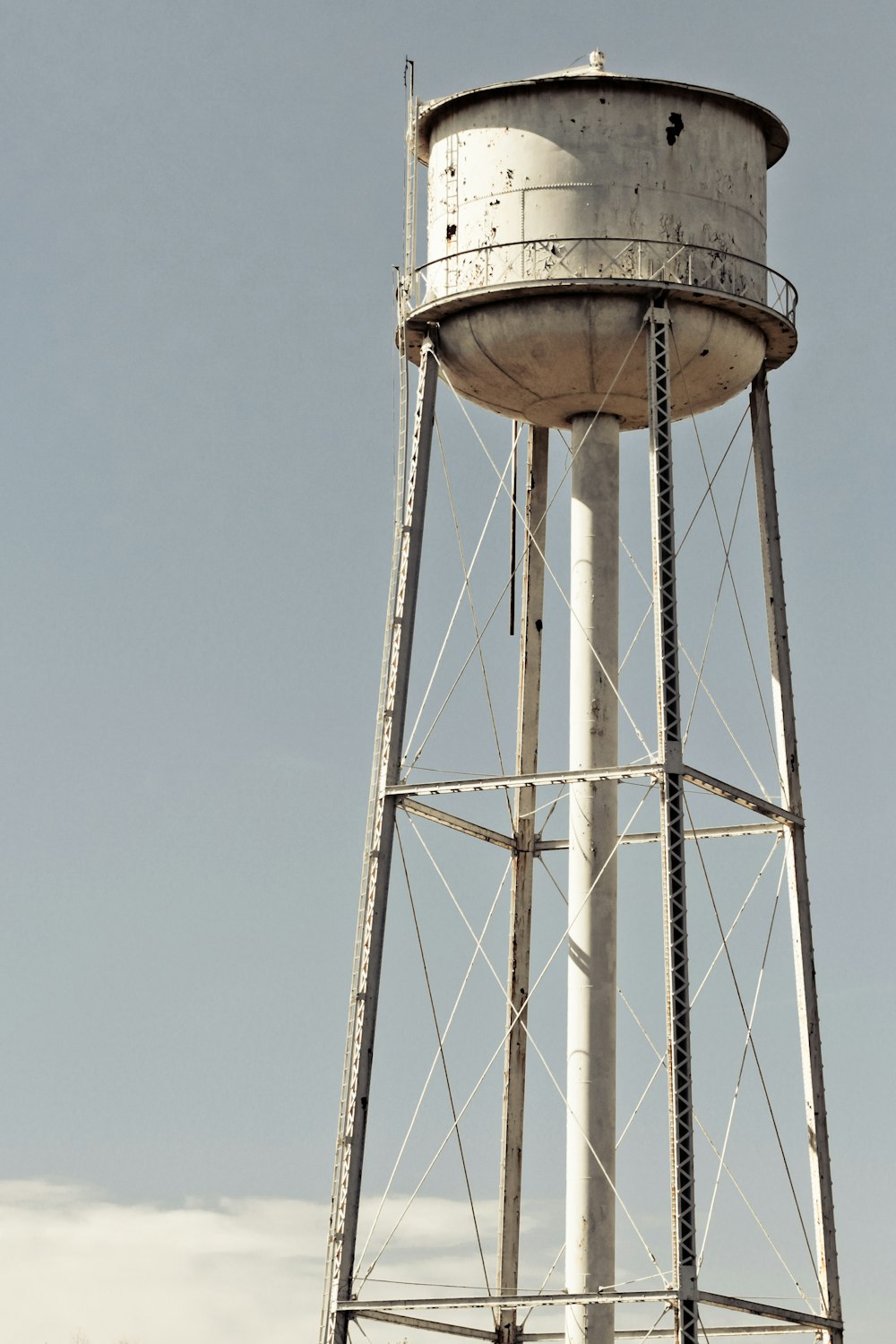 a water tower with a sky background