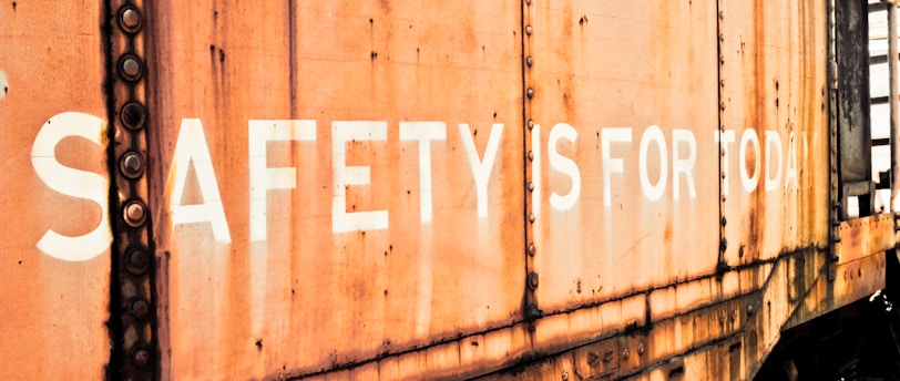 a rusted train car with the words safety is for all