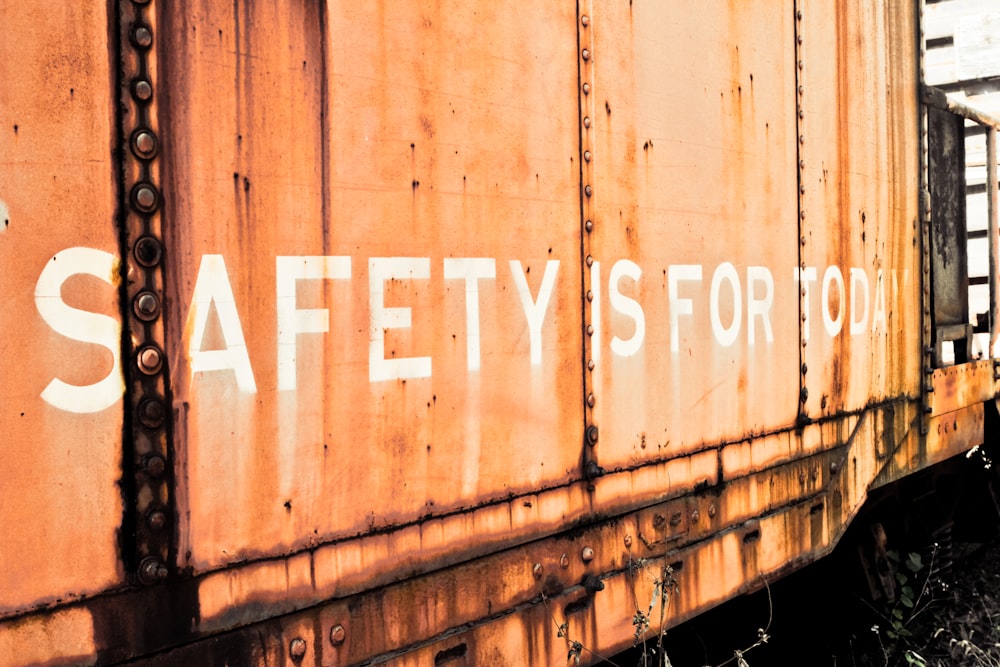 a rusted train car with the words safety is for all