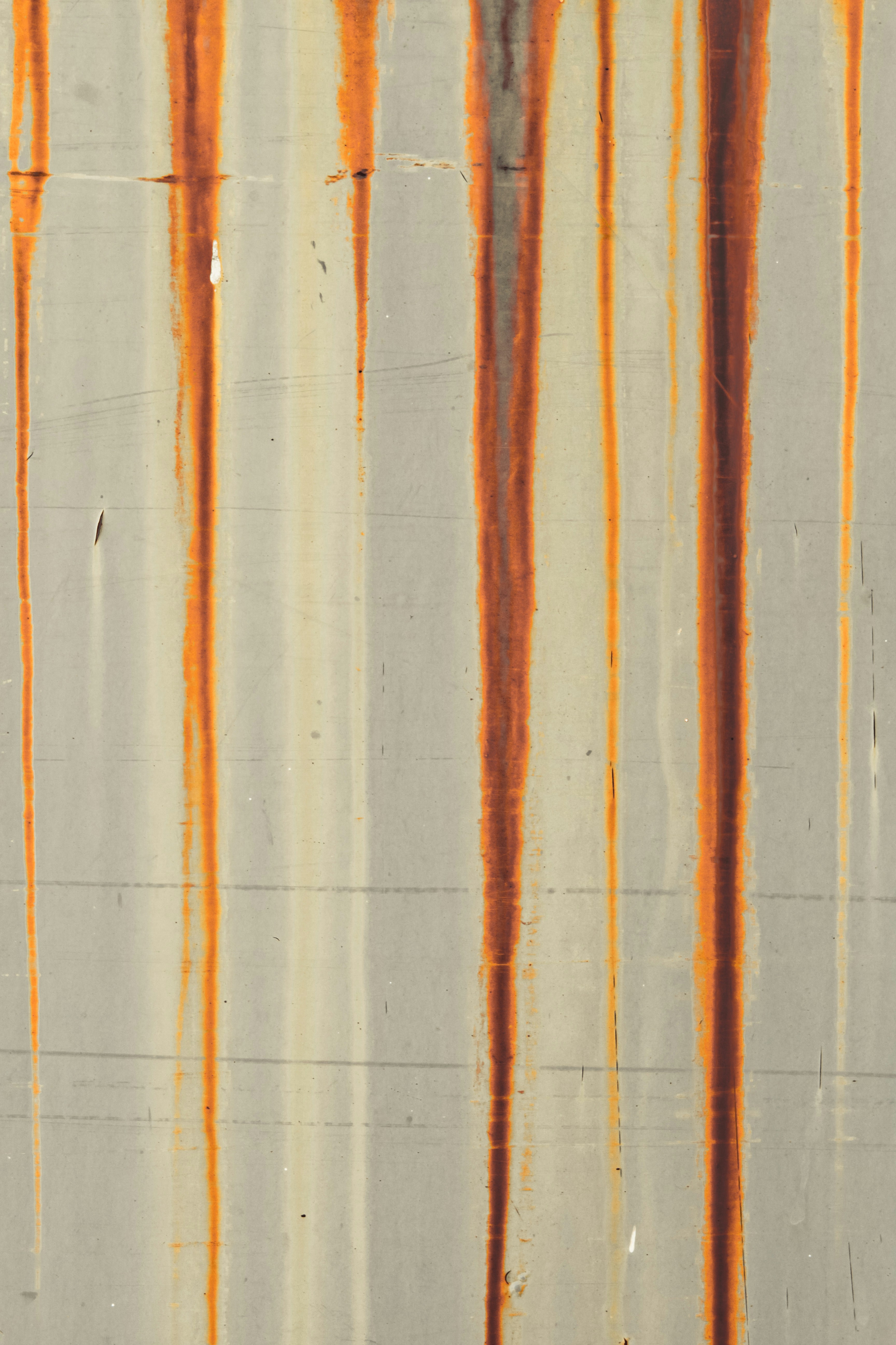 an orange line is painted on the side of a building