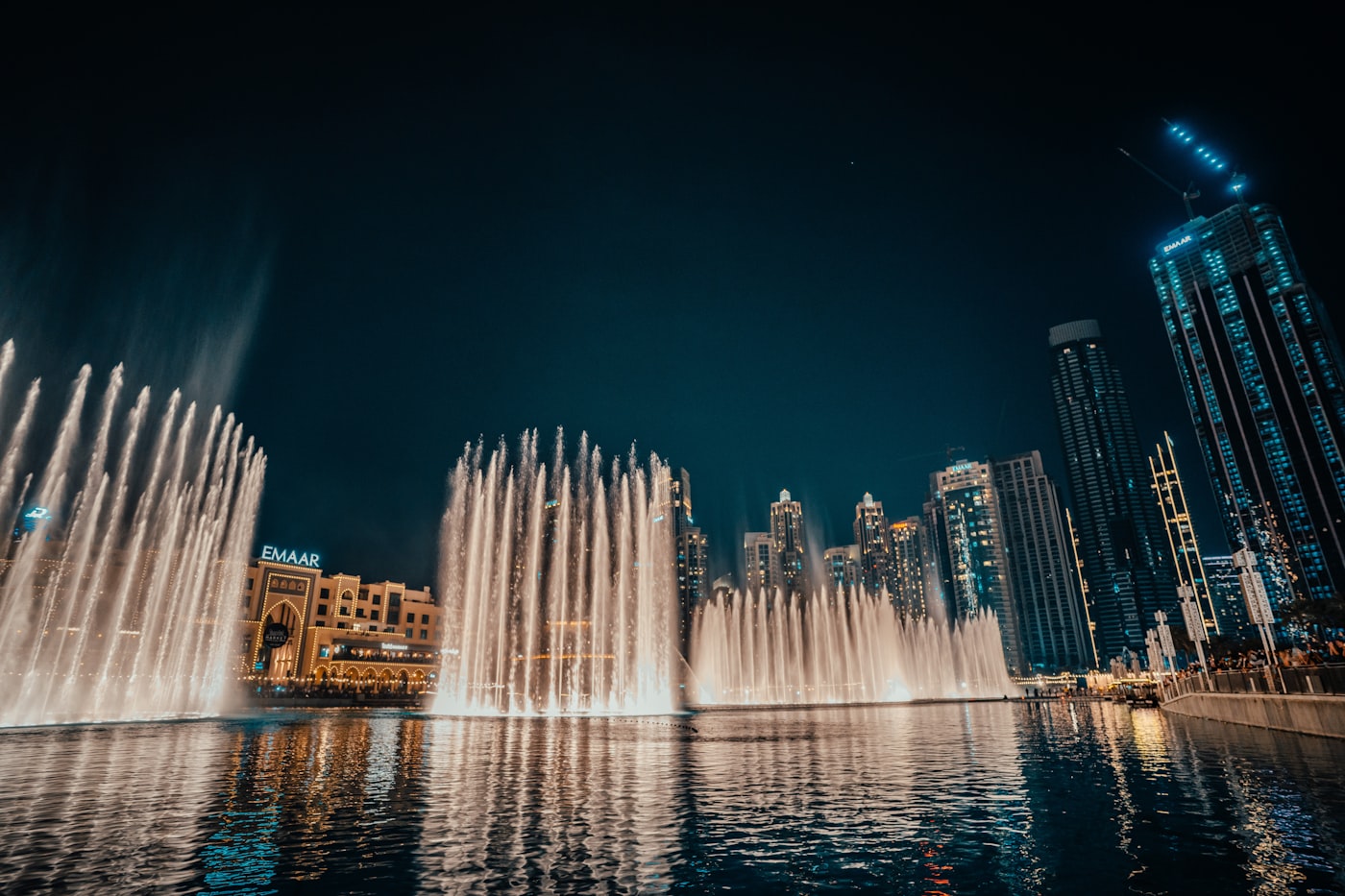 Downtown Dubai towers overlooking Burj Lake at dusk