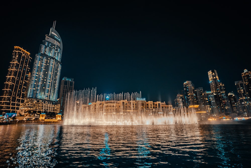 a large fountain in the middle of a body of water