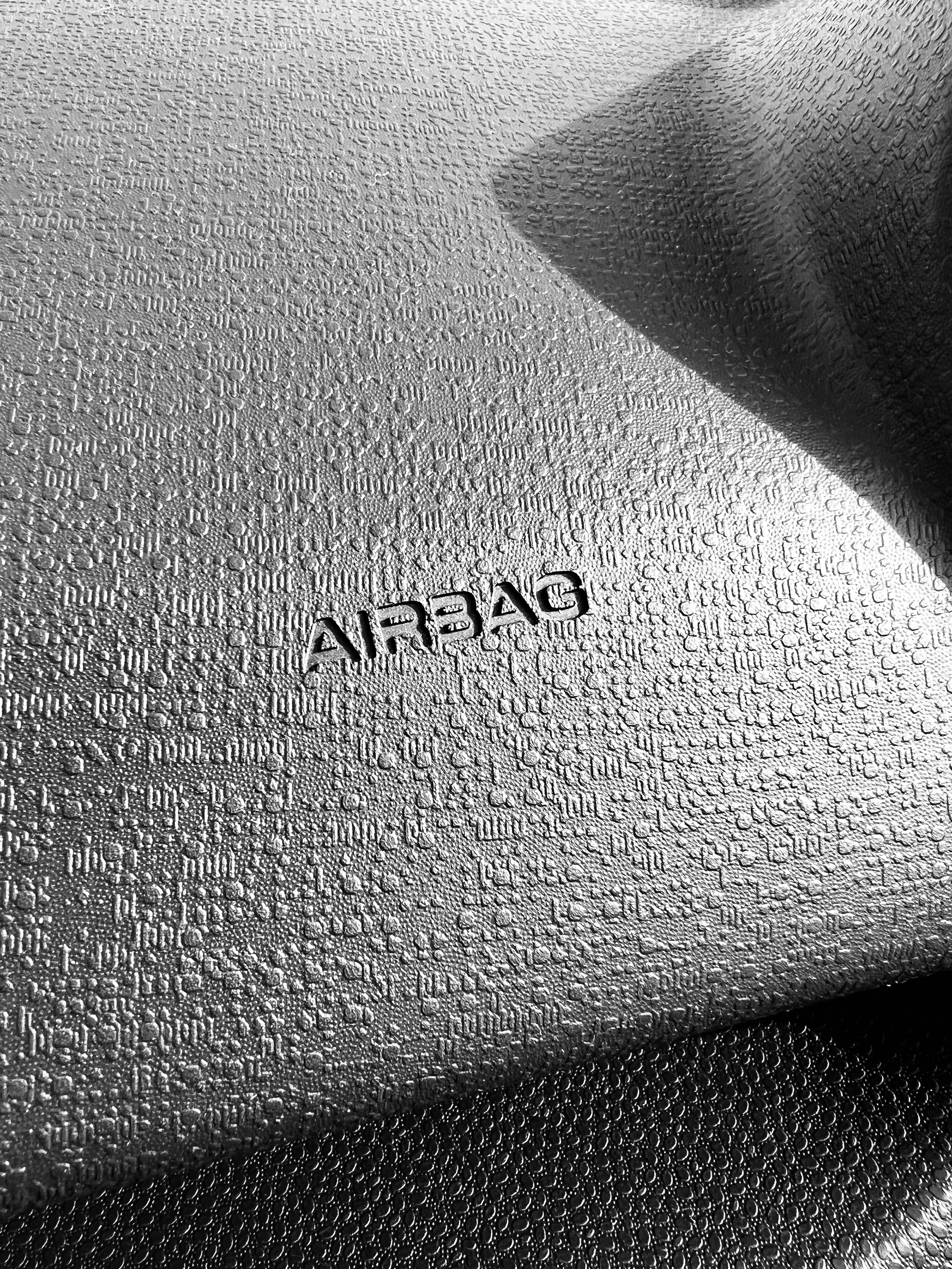 a close up of a bed with a name on it