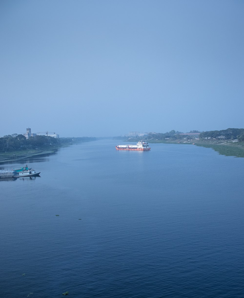 a large body of water with boats floating on it