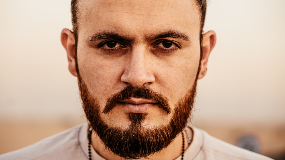 a close up of a man with a beard