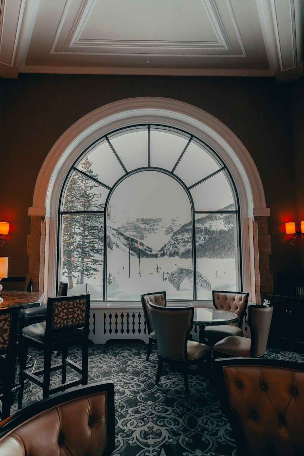 a living room filled with furniture and a large window